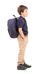 Fototapeta premium Full length portrait of a school boy with backpack standing