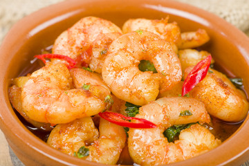 Gambas Pil Pil (Sizzling prawns with chili and garlic). Tapas.
