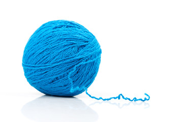 Blue ball of yarn on white