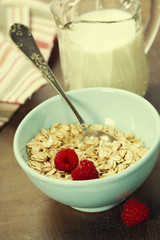 healthy breakfast with bowl of oat flakes