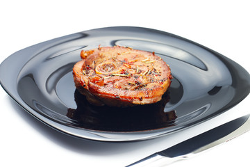 Grilled meat steak at black plate on white  background