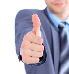 Businessman shows the thumbs up.