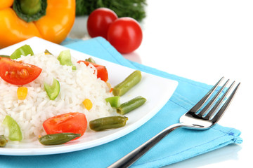 Delicious risotto with vegetables isolated on white
