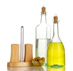 Original glass bottles with salad dressing isolated on white