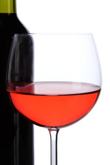 Red wine glass and bottle of wine isolated on white