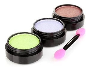 Bright eye shadows and sponge brushes for foundation isolated