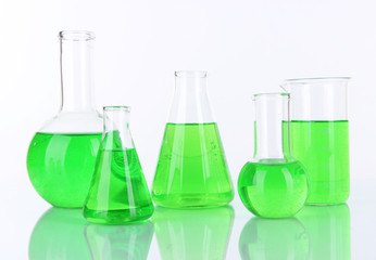 Test-tubes with green liquid isolated on white