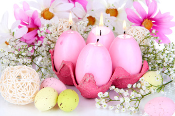 Easter candles with flowers close up