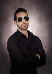 Fototapeta premium Young bearded businessman with sunglasses