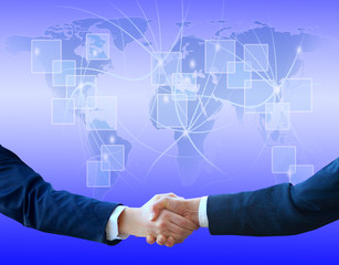Handshake with map of the world in background