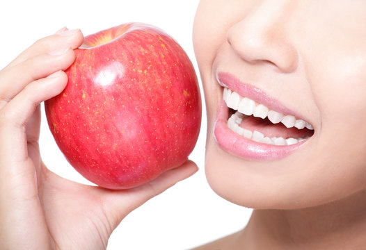 Young Woman Eating Red Apple With Health Teeth