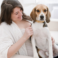 young woman with her cute beagle