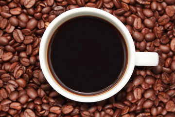 cup of coffee with coffee beans