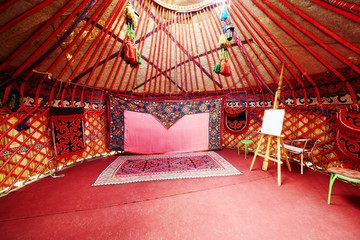 Interior of asian marquee with easel for drawing © Pavel Losevsky