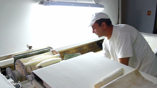 Worker in the production of bread