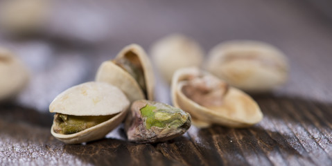 Pistachios on wood (macro shot)