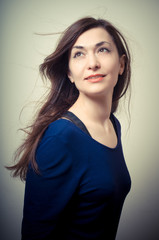 Obraz premium portrait of beautiful girl with long hair and blue sweater