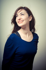 Fototapeta premium portrait of beautiful girl with long hair and blue sweater