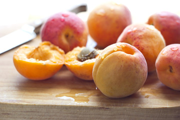 apricots on wooden cutting board