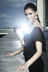 Pretty girl posing on city location