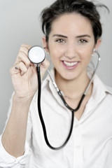 Female doctor using a stethoscope