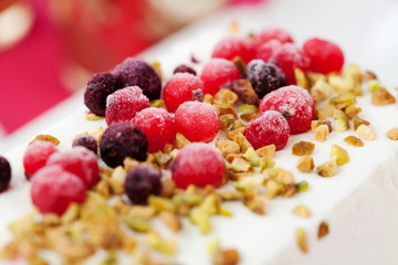 Ice cream cake with berries and nuts: close up