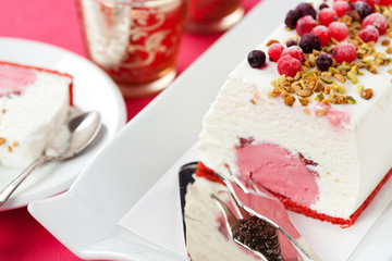 Ice cream cake with berries and nuts