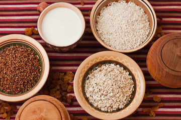 Buckwheat, oat flakes, rice and milk