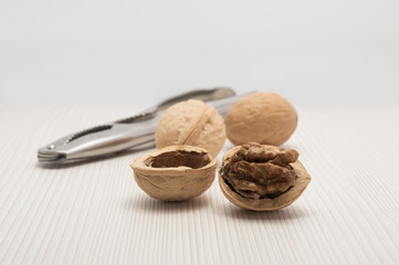 nutcracker in the table together with nuts