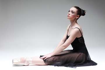 Beautiful ballet-dancer, modern style dancer posing on studio © Pandorabox