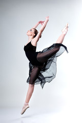 Beautiful ballet-dancer, modern style dancer posing on studio © Pandorabox