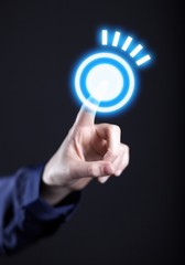 Woman's hand pushing the blue button, touch screen