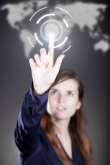 Woman's hand pushing network button on touch screen