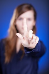 Woman's hand, one finger pointing something