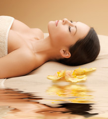 Fototapeta na wymiar woman in spa salon lying on the massage desk