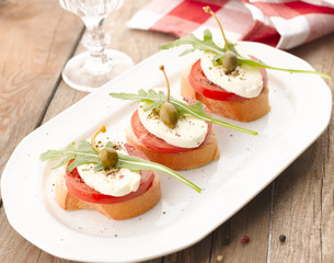 Canapes with tomatoes and mozzarella