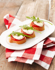 Canapes with tomatoes and mozzarella