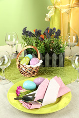 Easter table setting on color background