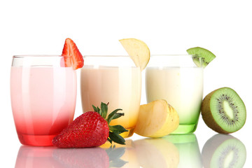 Delicious yogurts with fruits in glasses isolated on white
