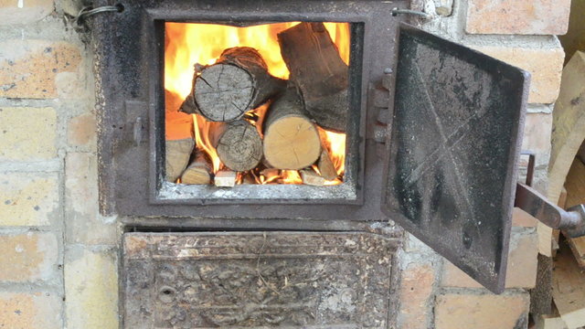 firewood wood burn in retro old rusty rural kitchen stove