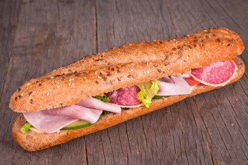 Fresh French healthy baguette on wood 