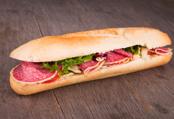 Fresh French healthy baguette on wood 