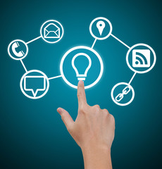 Hand pointing to business icons