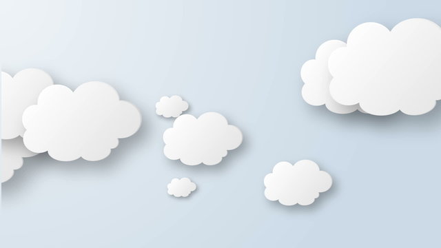 Cartoon Clouds on bright blue background.