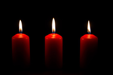 Red candles with black background