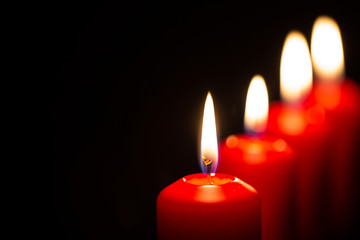 Red candles with black background