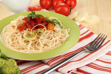 Tasty spaghetti with sauce and vegetables
