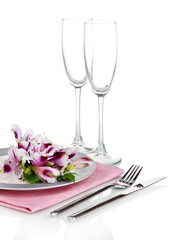 Festive table setting with flowers isolated on white
