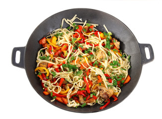 Noodles with vegetables on wok isolated on white - obrazy, fototapety, plakaty
