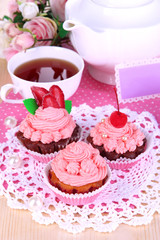 Beautiful strawberry cupcakes and flavored tea